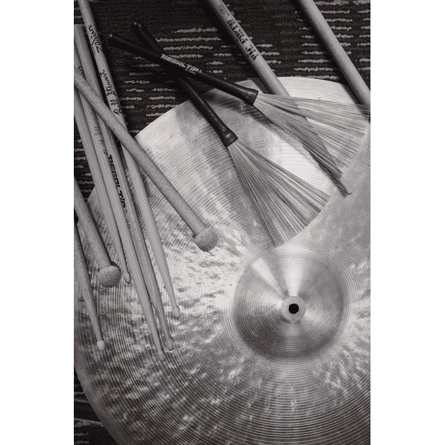 Drumsticks, brushes, and cymbal, black and white. Free lesson consultation with Ryan Barski