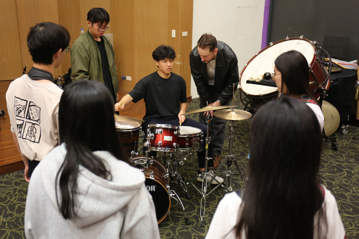 Students gathered around the drum kit at Ryan Barski's masterclass in Taiwan