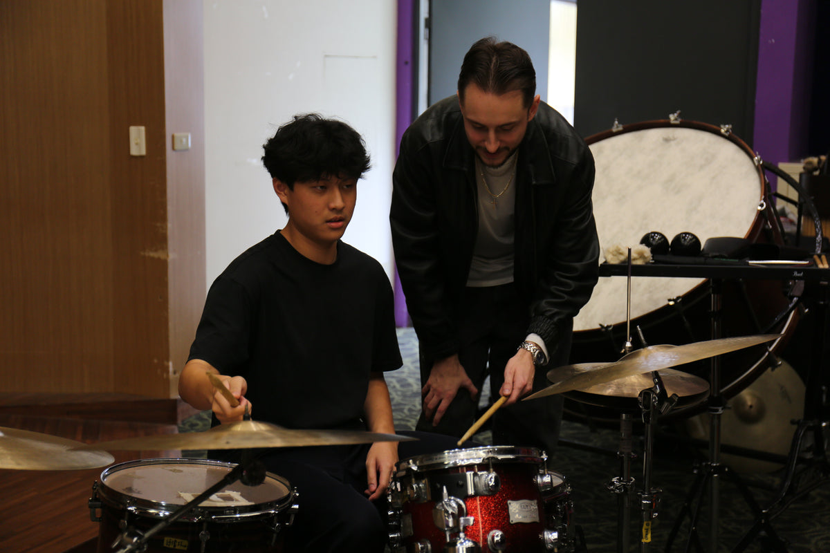 Ryan Barski coaching a drum student during a masterclass in Chiayi, Taiwan