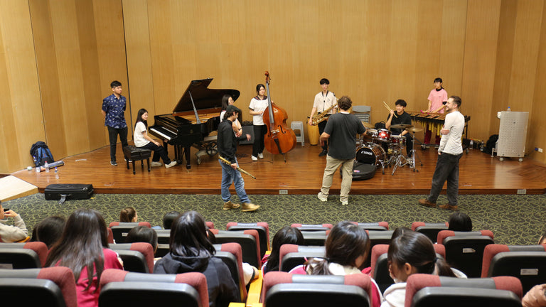 Side Step on stage at the Chiayi masterclass in Taiwan, audience in the foreground